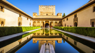 Stunning photo showcases Alhambra Palace's grandeur, intricate architecture, and historical significance beautifully captured.